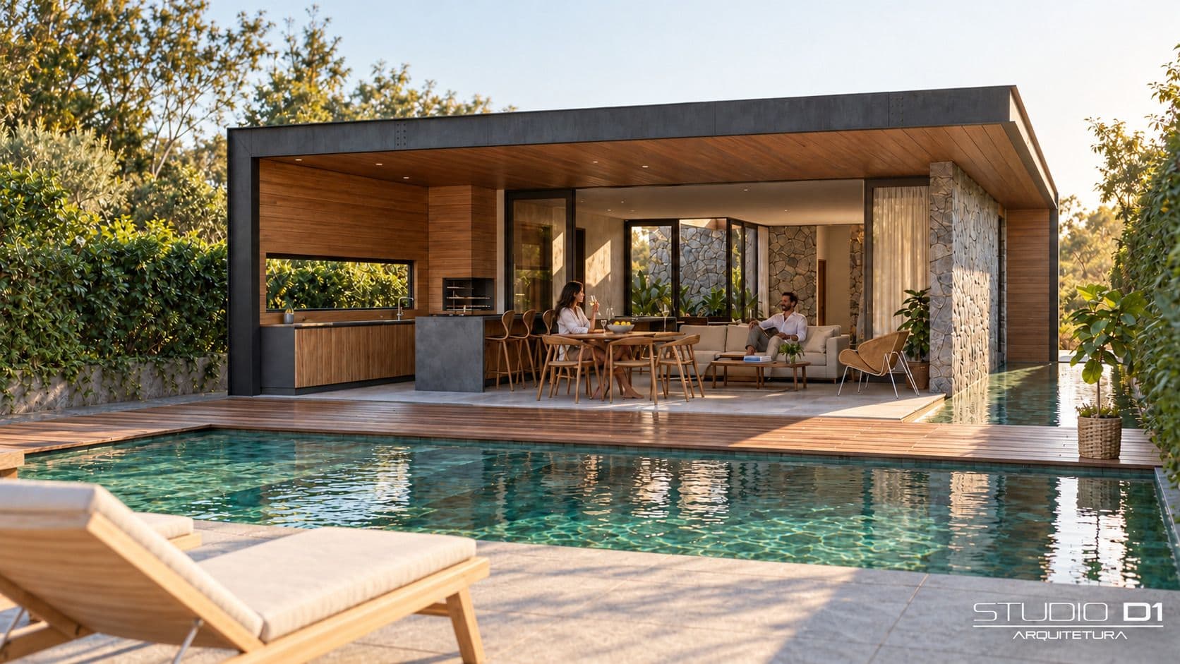 Pavilhão com cozinha e estar abertos para a piscina, de dia.